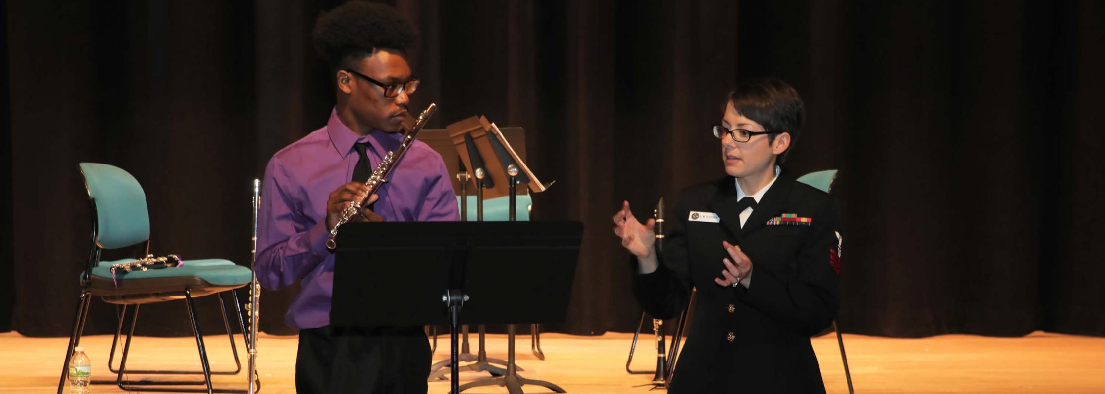 student receiving instruction on flute